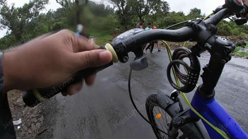 pushing cycle up the hill- lonavala cycling bhaja and karla caves