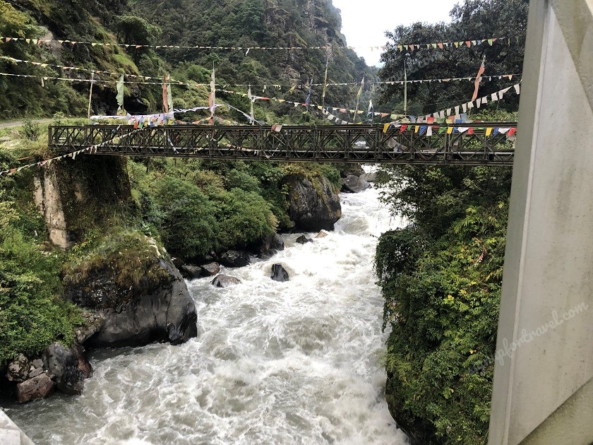 Bridge and gushing water beneath near Tawang
